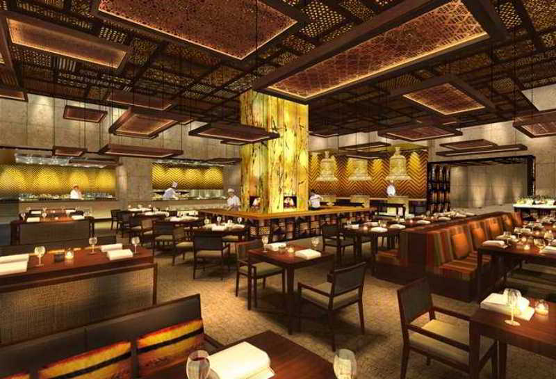 Hilton Jaipur Hotel Buitenkant foto The interior of the restaurant