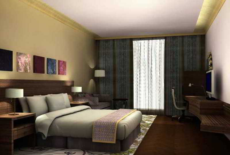 Hilton Jaipur Hotel Buitenkant foto A typical hotel room